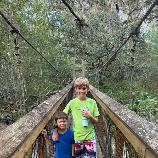 Family walking a Florida nature boardwalk